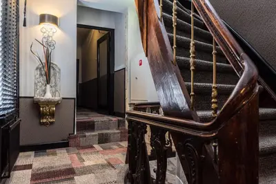 a hallway with a stairway with a stair case at Hotel Amstelzicht in Amsterdam