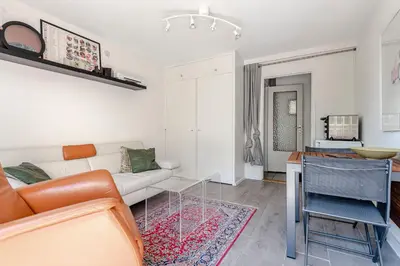 a living room with a couch and a table at Apartment Garden & Bed in Zandvoort