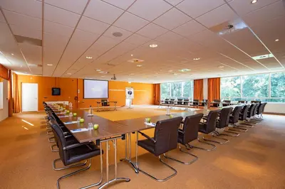 a large conference room with a large table and chairs at Fletcher Hotel Restaurant Amersfoort in Amersfoort