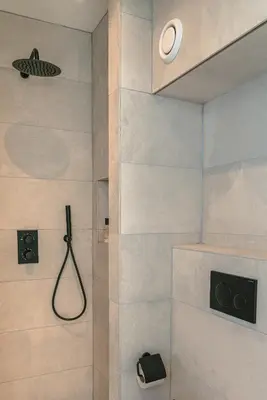 a bathroom with a shower with a shower head at Elegant Boutique Apartment 45m2 w Amazing Views in Amsterdam