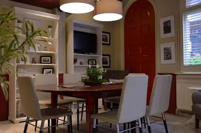 a dining room with a wooden table and chairs at Best Western Dam Square Inn in Amsterdam