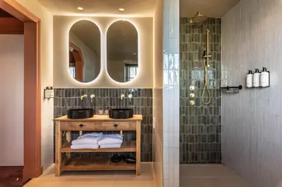 a bathroom with a sink and a shower at The Butchersfarm in Ter Aar