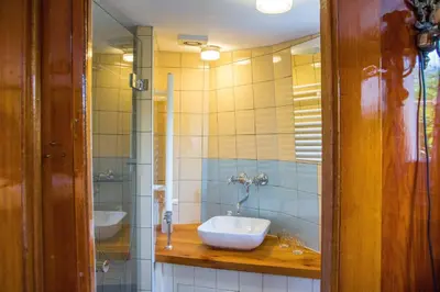 a bathroom with a sink and a mirror at Westerdok25 in Amsterdam