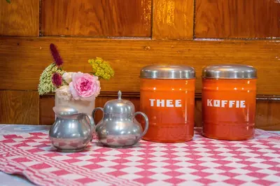 three jars on a table with a checkered table cloth at Westerdok25 in Amsterdam