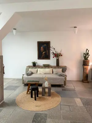 a living room with a couch and a table at Pothuis Zuid in Zandvoort