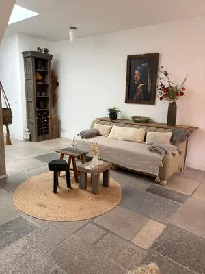 a living room with a couch and a table at Pothuis Zuid in Zandvoort