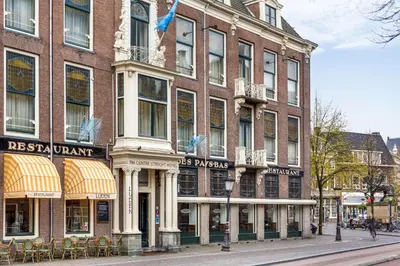 a large brick building on a city street at NH Centre Utrecht Hotel in Utrecht