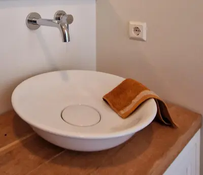a white sink sitting on a counter in a bathroom at Studio Flevo Batavia in Lelystad