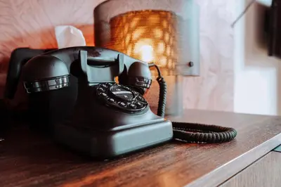 a telephone sitting on top of a table at The Highlander Amsterdam in Amsterdam