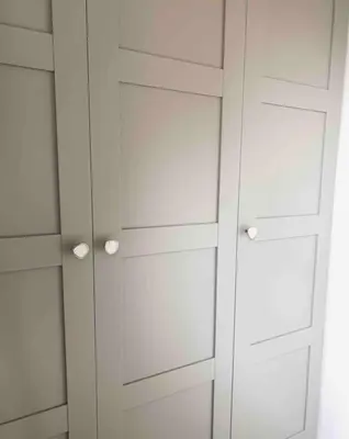 a white closet with two doors at The Bank's Lodge by ZILT in Limmen