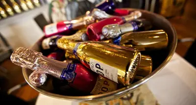 a bucket filled with bottles of wine at Hampshire Hotel Petit Nord in Hoorn