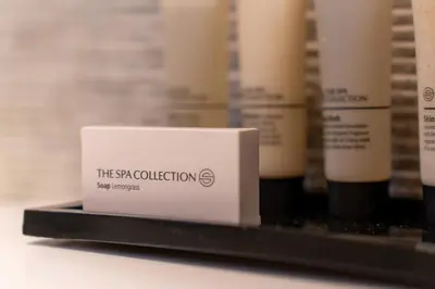 a white box on a shelf with other products at Boutique Hotel Albus Amsterdam Centre in Amsterdam