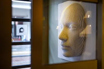a statue of a head behind a window at Boutique Hotel Albus Amsterdam Centre in Amsterdam