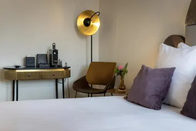 a hotel room with a bed and a desk at Boutique Hotel Albus Amsterdam Centre in Amsterdam