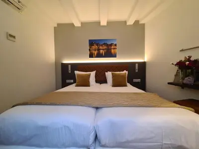 a bedroom with a large bed in a room at Avenue Hotel in Amsterdam