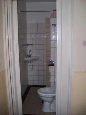 a bathroom with a toilet and a sink at Hotel de Westertoren in Amsterdam