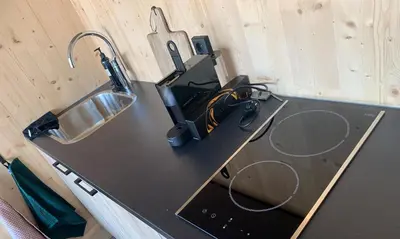 a black counter top with a sink and a sink at GreenFloat Boskoop #2 Mica & Luca in Boskoop