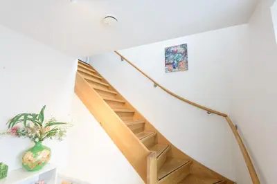 a staircase in a house with a vase at Spacious and attractive family home near Amsterdam in Overveen