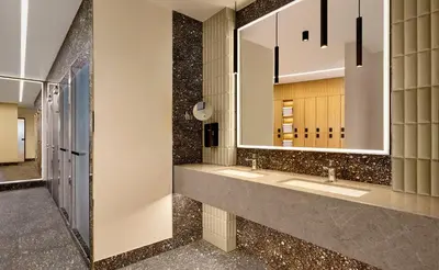 a bathroom with two sinks and a mirror at Sheraton Amsterdam Airport Hotel and Conference Center in Schiphol