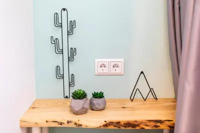 a table with two plants on top of it at Hotel Pagi in Amsterdam