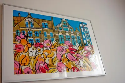 a painting of flowers in front of a building at Hotel Verdi in Amsterdam
