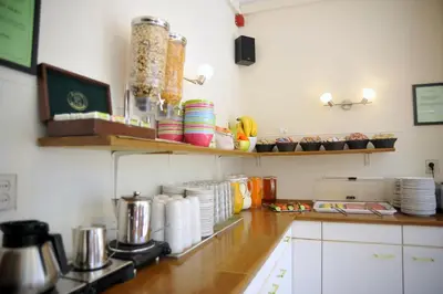 a kitchen with a counter top with plates and dishes at Hotel Abba in Amsterdam