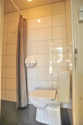 a bathroom with a toilet and a sink at Hotel Abba in Amsterdam