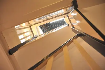 an empty staircase with a window in a room at Hotel Abba in Amsterdam