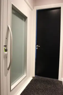 a black door with a window in a room at Sara's Boutique Hotel in Amsterdam
