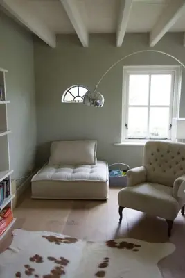 a living room with a couch and a chair at Farmvilla with hottub and outdoor kitchen in Beets
