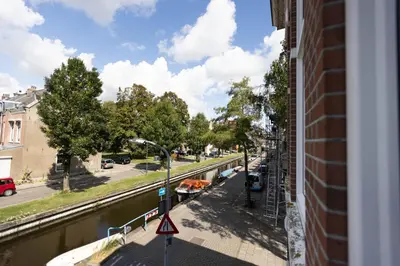 a view of a river from a building at B&B Brouwersvaart in Haarlem