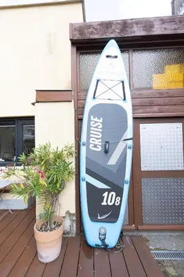 a blue kayak is parked next to a building at B&B Brouwersvaart in Haarlem