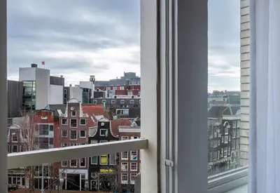 a view of a city from a window at WestCord City Centre Hotel in Amsterdam