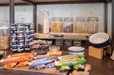 a kitchen counter with jars of food and other ingredients at Boutique Hotel Herbergh Amsterdam Airport FREE PARKING in Badhoevedorp