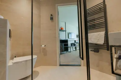 a bathroom with a toilet and a walk in shower at Boutique Hotel Herbergh Amsterdam Airport FREE PARKING in Badhoevedorp