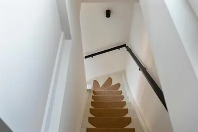 a staircase leading up to the basement of a house at The Modern Burrow in Zandvoort
