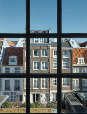 a view of a building from a window at Pulitzer Amsterdam in Amsterdam
