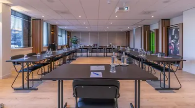 a large conference room with tables and chairs at Fletcher Hotel Jan van Scorel in Schoorl