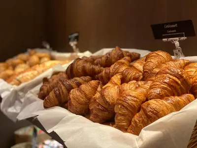 a bunch of croissants and other pastries on a table at Fletcher Hotel Jan van Scorel in Schoorl
