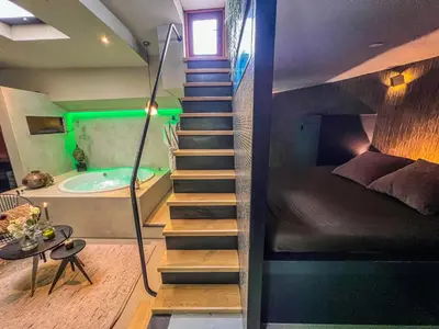 a staircase leading up to a bathroom with a tub at Boat & Boost Amsterdam in Amsterdam