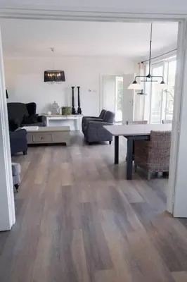 a living room with a couch and a table at Vakantiebungalow Limmen in Limmen
