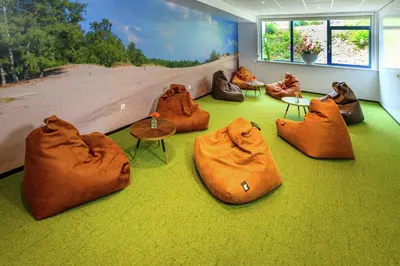 a room with brown bags sitting on the floor at DoubleTree by Hilton Royal Parc Soestduinen in Amersfoort