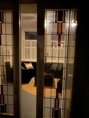 a view of a room through a glass door at B&B Vechtzicht in Weesp