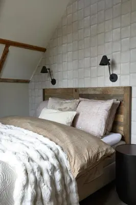 a bedroom with two beds and two lights on the wall at Brasserie Spoorhuis Mijdrecht in Mijdrecht