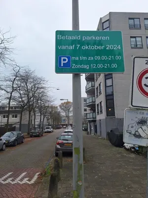 a street sign on a pole next to a street at Dubbelink 3A in Amsterdam