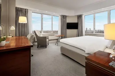 a hotel room with a bed and a desk at Hotel Okura Amsterdam – The Leading Hotels of the World in Amsterdam