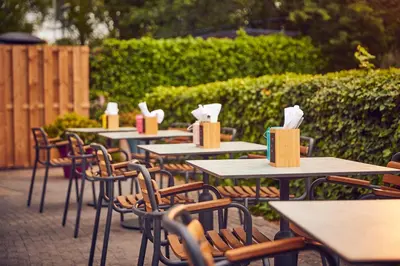 a row of tables and chairs with boxes on them at WestCord Art Hotel Amsterdam 3 stars in Amsterdam