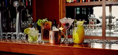 a bar with a bunch of different types of drinks at WestCord Art Hotel Amsterdam 3 stars in Amsterdam