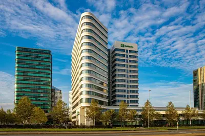 a tall building with a sign on the side of it at Holiday Inn Amsterdam - Arena Towers by IHG in Amsterdam
