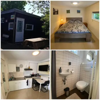 a bathroom and a bedroom with a bed and a sink at La Luna - Desi in Heerhugowaard